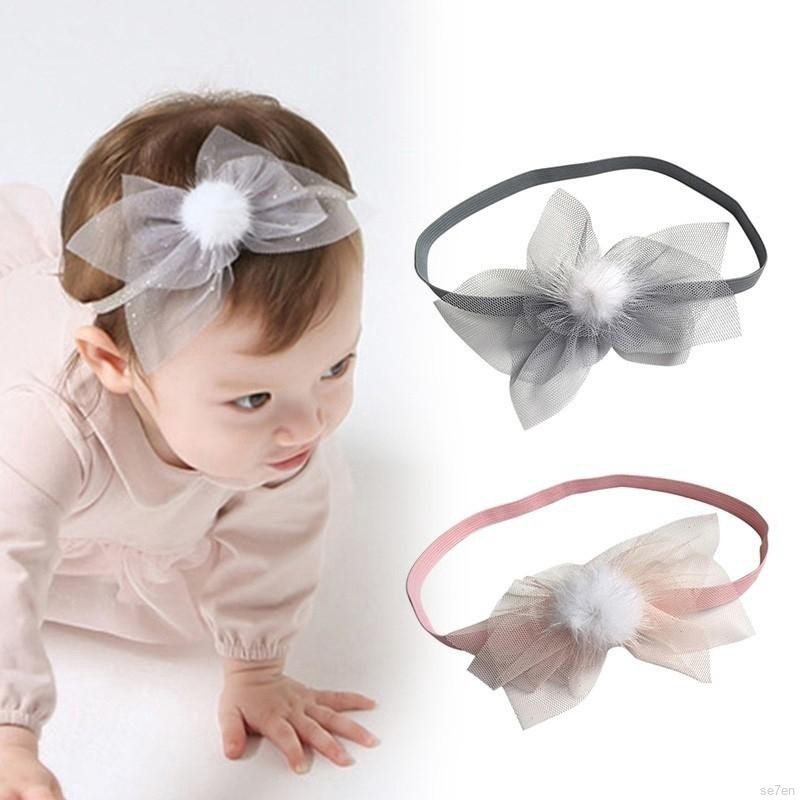 Băng đeo đầu có chi tiết quả bóng lông dễ thương cho bé