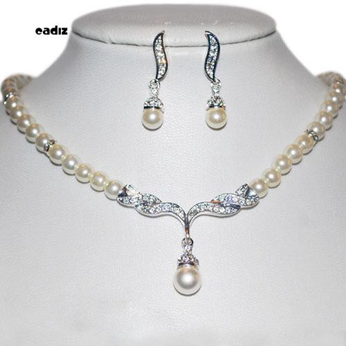 Bộ dây chuyền + bông tai hình đôi cánh đính ngọc trai giả