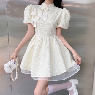 Đầm xốp nude tàu xoè nơ phối voan