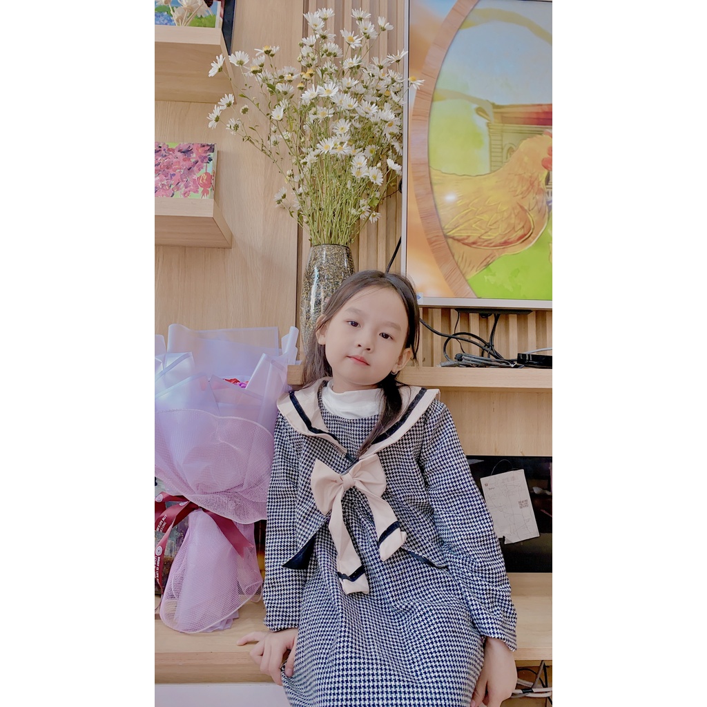 Váy dạ Dewkids kẻ nơ trắng phong cách Hàn Quốc cho bé