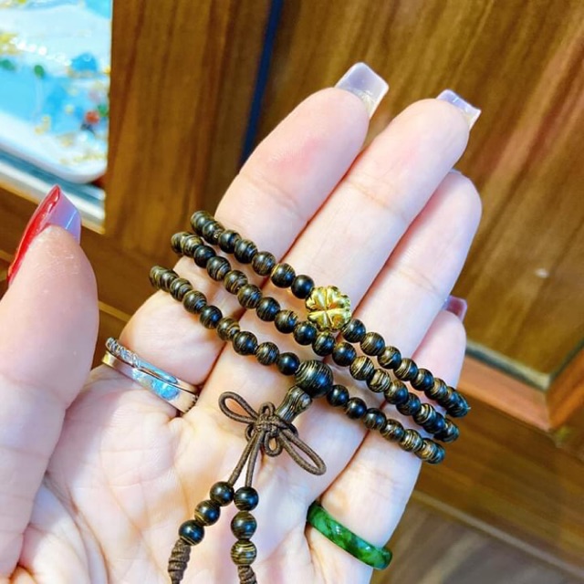 Trầm sánh chìm 4li quấn 3 vòng mix cỏ 4 lá vàng 10kara