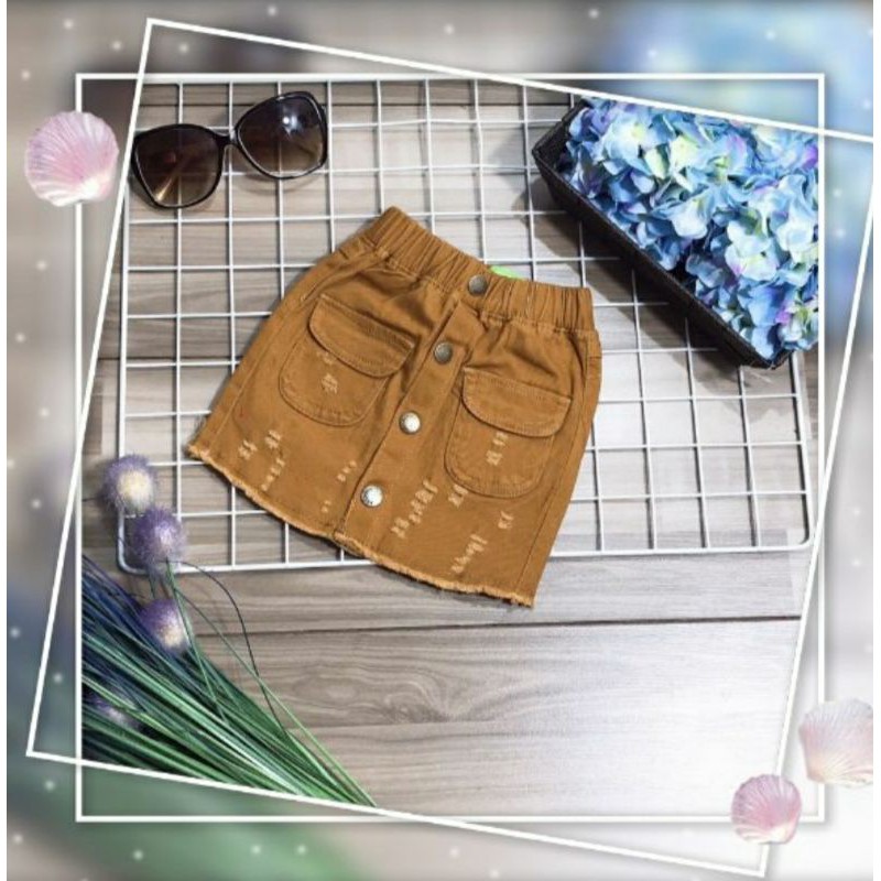 Chân váy kaki bé gái lưng thun đính nút, đắp túi, lai tua rua sành điệu, chất vải kaki co dãn nhẹ, mềm mại, thoáng mát,,