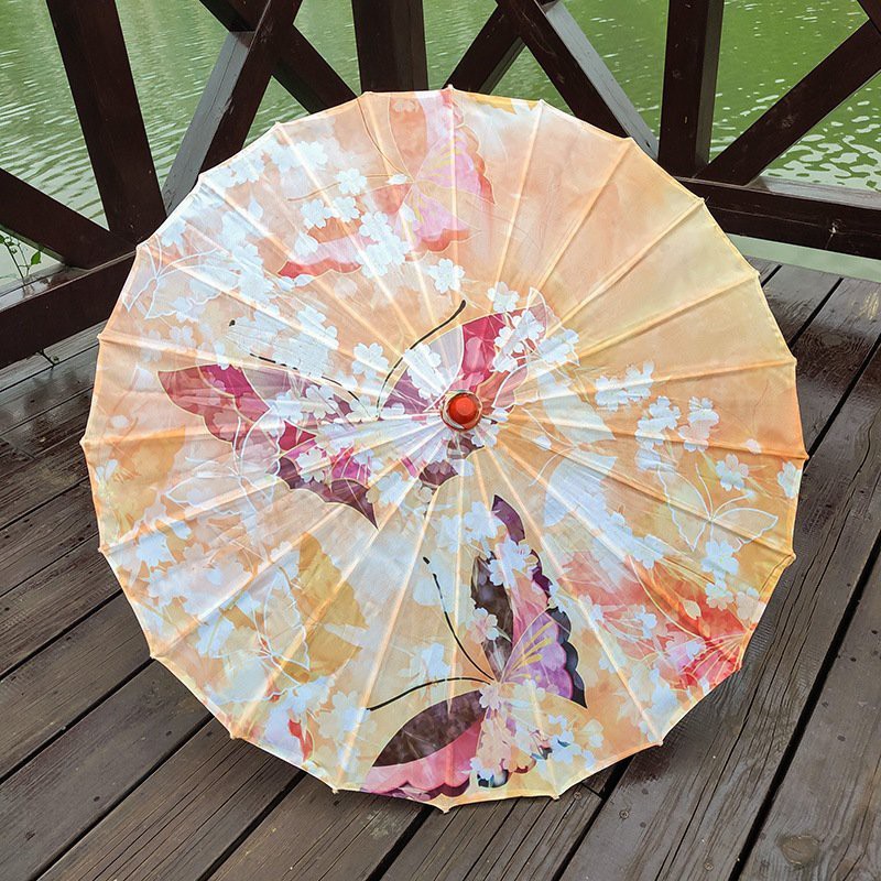 Ô cổ trang ĐÀO CỐ LÊN BẠCH TRÀ ĐIỆP CHIM ĐÀO TRÚC XANH HOÀNG ĐIỆP dù vải cầm tay gắn tua rua họa tiết phong cảnh mẫu mới