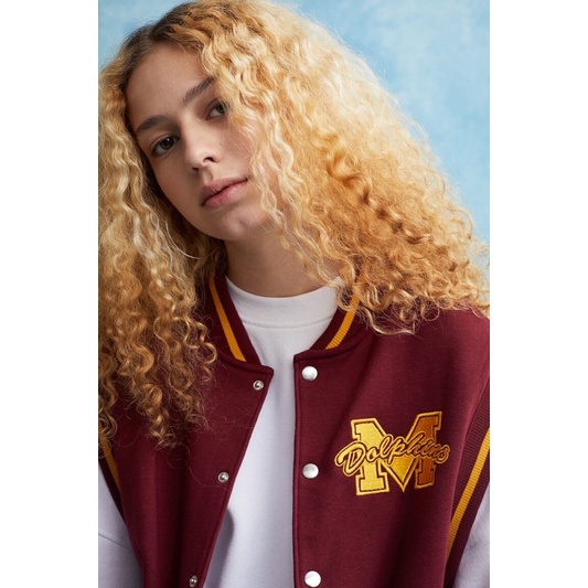 Áo H&M x Sex Education Varsity Gilet Moordale