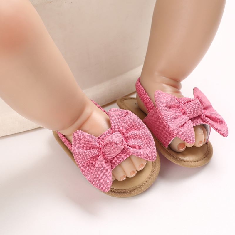 Giày tập đi đế mềm đính nơ dễ thương cho bé gái