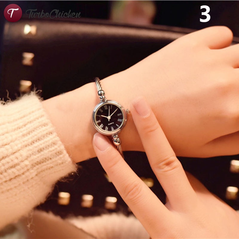 1 đồng hồ đeo tay mặt tròn mini bằng hợp kim phong cách vintage cho nữ