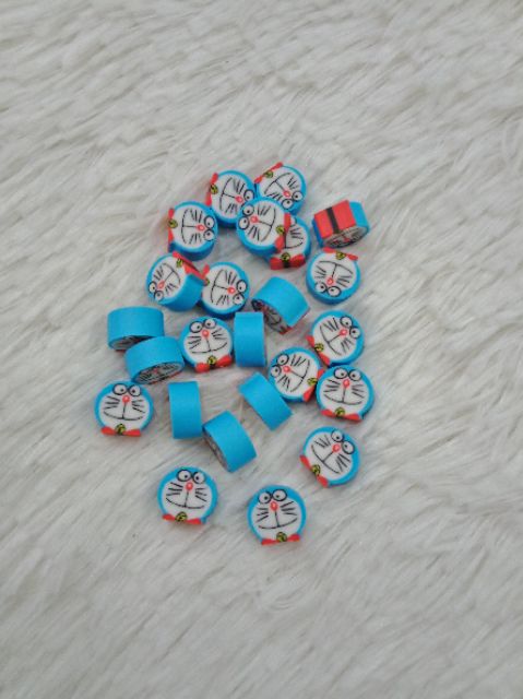 Gôm mini trong bình sữa Doraemon và Kitty 1cmx1cmx24 cục SP000029