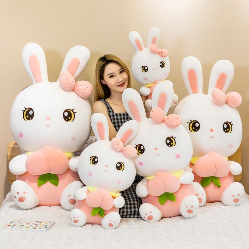 Gấu bông thỏ hồng, thỏ tai dài nhồi bông ôm trái đào vải miniso cao cấp - Unishop