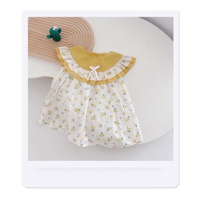 Váy hoa nhí cổ bèo vàng tím cho bé gái (9-21kg)