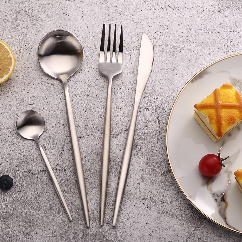 Western steak cutlery and Western style Portuguese silver knife and fork.