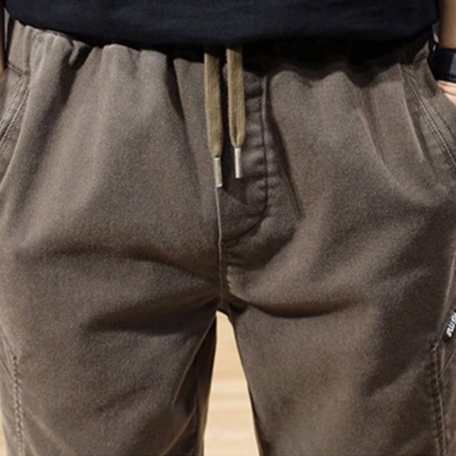 Quần jogger nam kaki cao cấp dáng hàn, hàng xuất khẩu có size lớn dây rút ống rộng màu nâu và đen LDQ2