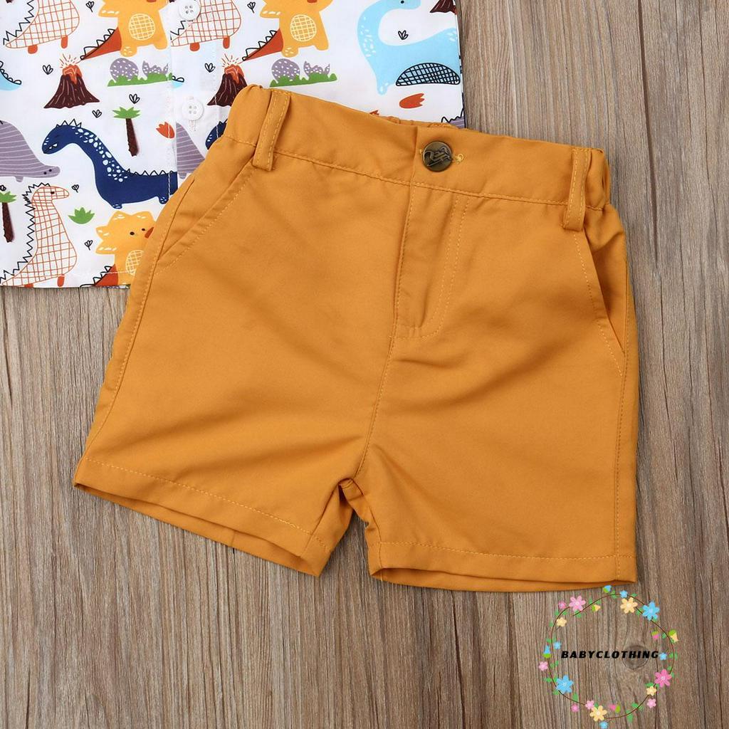 Set trang phục bé trai 2 món gồm áo sơ mi tay ngắn họa tiết khủng long và quần short thời trang