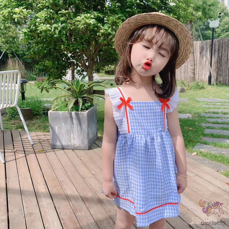 Đầm Sọc Caro Thắt Nơ Cho Bé Gái
