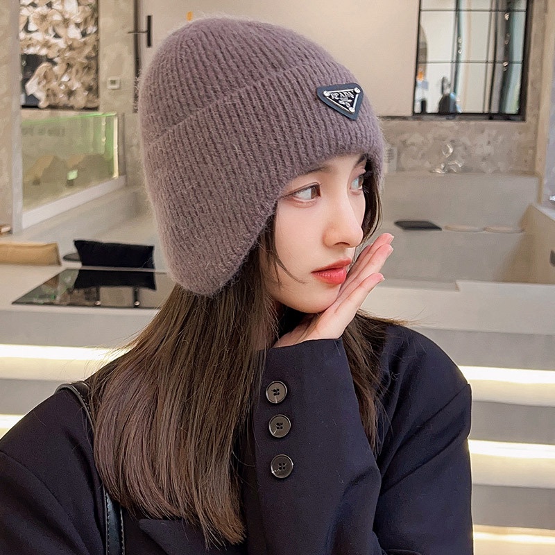 Mũ bảo vệ tai ấm áp của phụ nữ nam giới yêu thích nhãn tam giác mùa thu và mùa đông gió và bảo vệ lạnh áo pull dệt kim đi xe đạp ngoài trời boutique mũ len lông thỏ