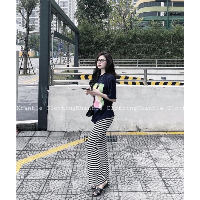 Áo phông ảnh cô gái tóc vàng váy hồng TTA788