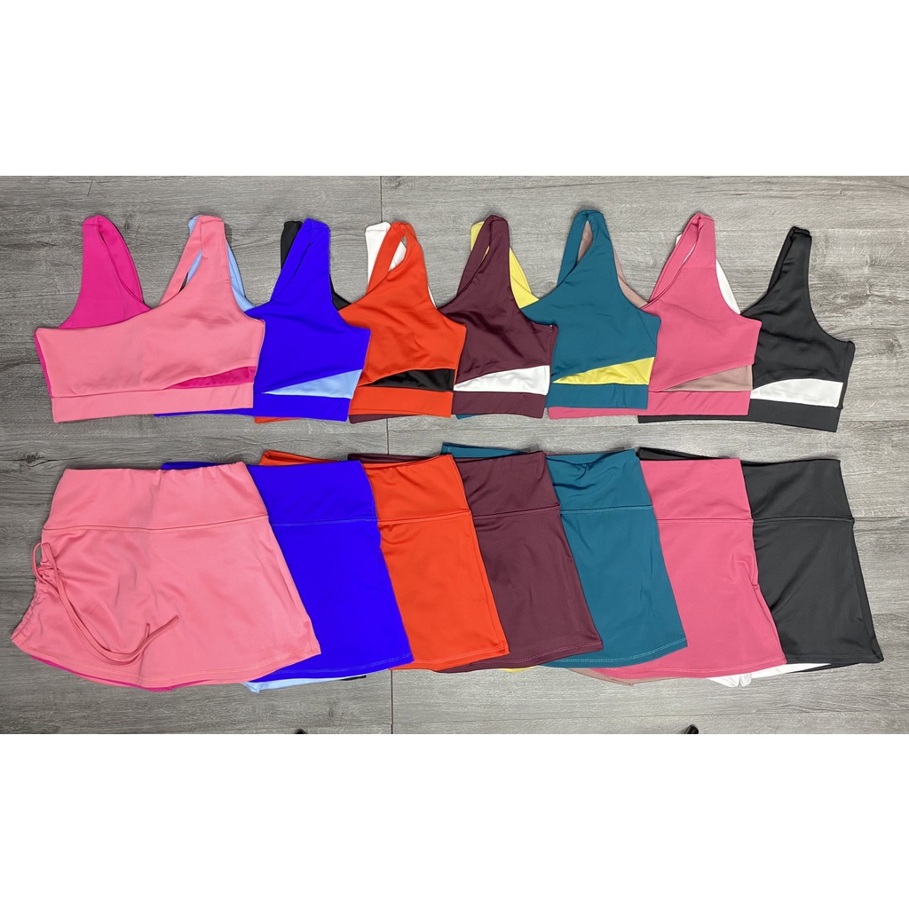 Đồ tập gym nữ, set bộ đùi thể thao phối màu áo bra kèm mút quần đùi váy dây rút Bin Sports BN037