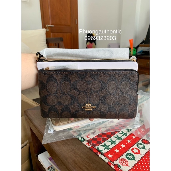 Ví cầm tay Coach logo signature canvas AUTHENTIC