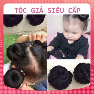 Tóc búi tròn xinh xắn đang yêu cho bé gái dạng kẹp mỏ vịt