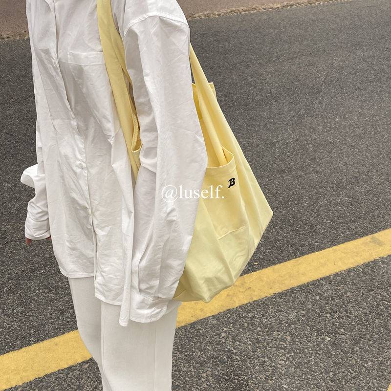 Túi đeo vai vải canvas màu vàng nhạt phong cách hè dành cho nữ