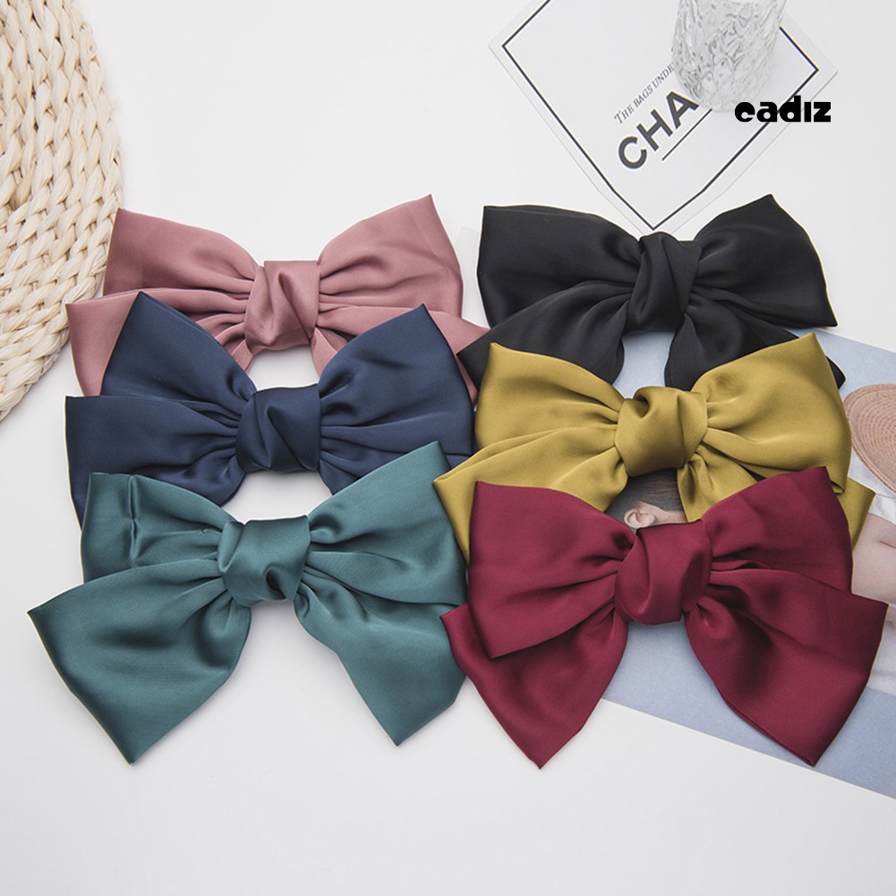 Kẹp tóc nơ màu trơn xinh xắn đáng yêu