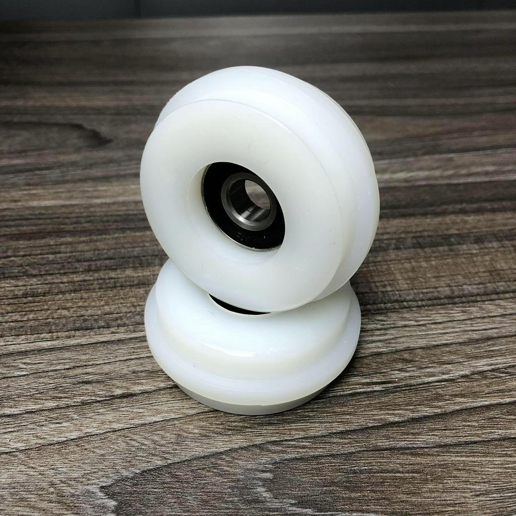 Bánh xe con lăn cửa lùa cửa trượt phi 68mm dùng cho ray lùa âm D6826d12T7D