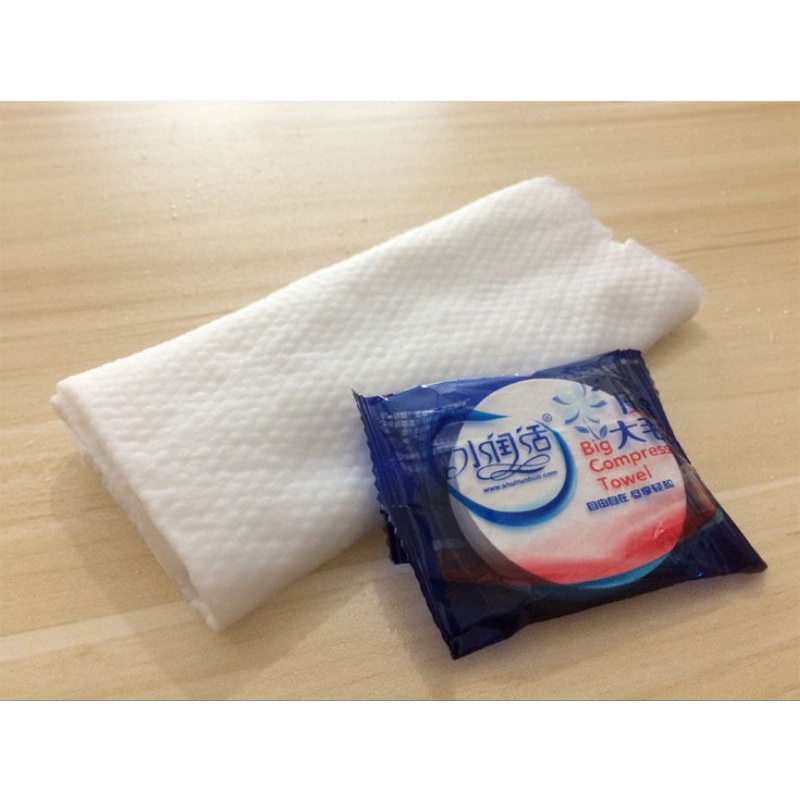 1 CÁI KHĂN MẶT NÉN DU LỊCH BỊCH MÀU XANH KT 30*60CM