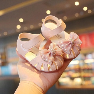 Sandal tập đi bé gái đính nơ hoa