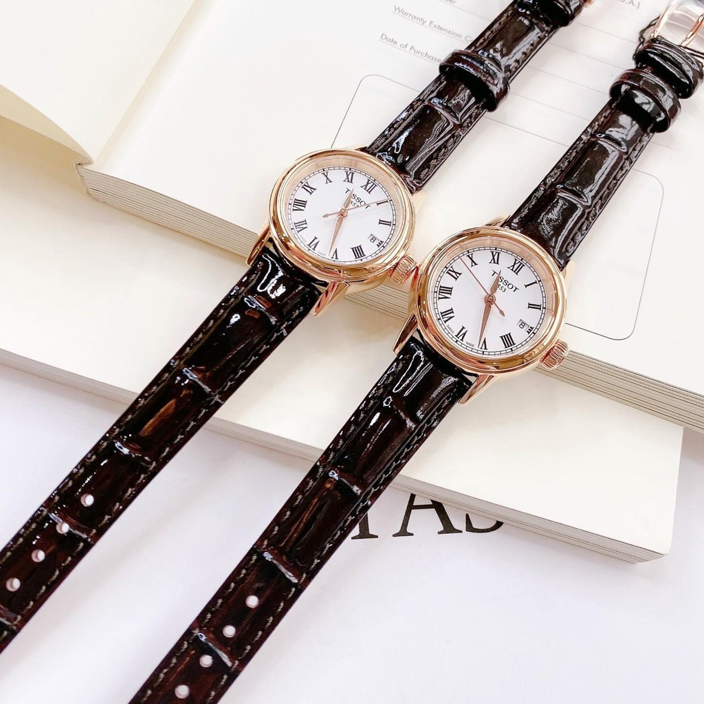 Đồng hồ Tissot nữ mặt tròn, dây da đen, viền vàng hồng T0852103601300