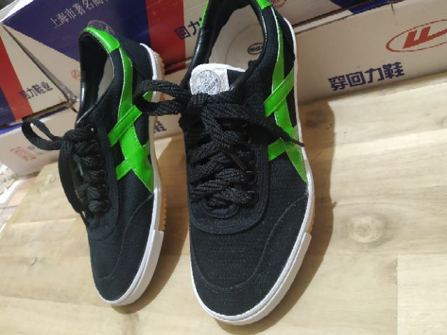 Giày bata warrior đen sọc xanh lá