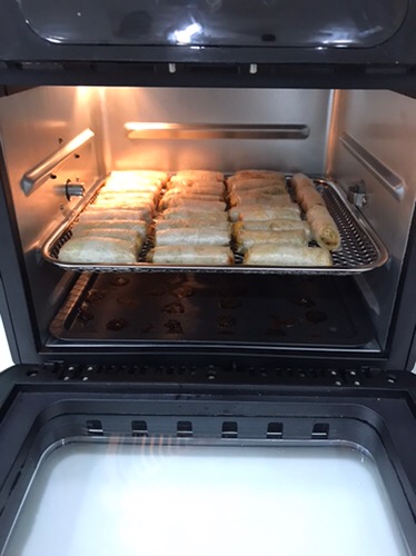 An aerial view of waves crashing against a shore.