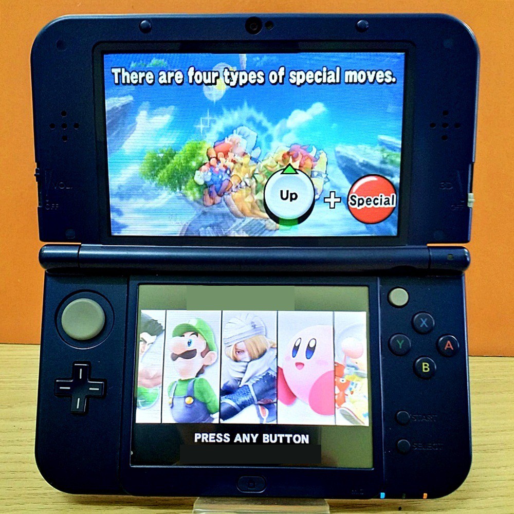 Máy chơi game New 3DS XL màu xanh đã hack, thẻ 32 GB