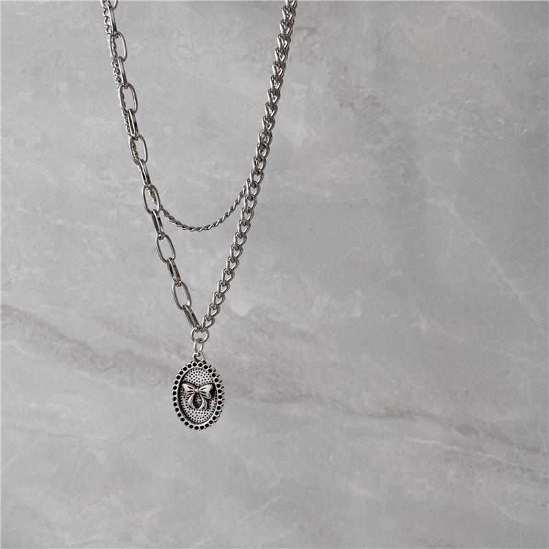 Vòng cổ Dạng Chuỗi Kép Mặt Hình Nơ Màu Bạc Phong Cách Punk Hiphop Thời Trang