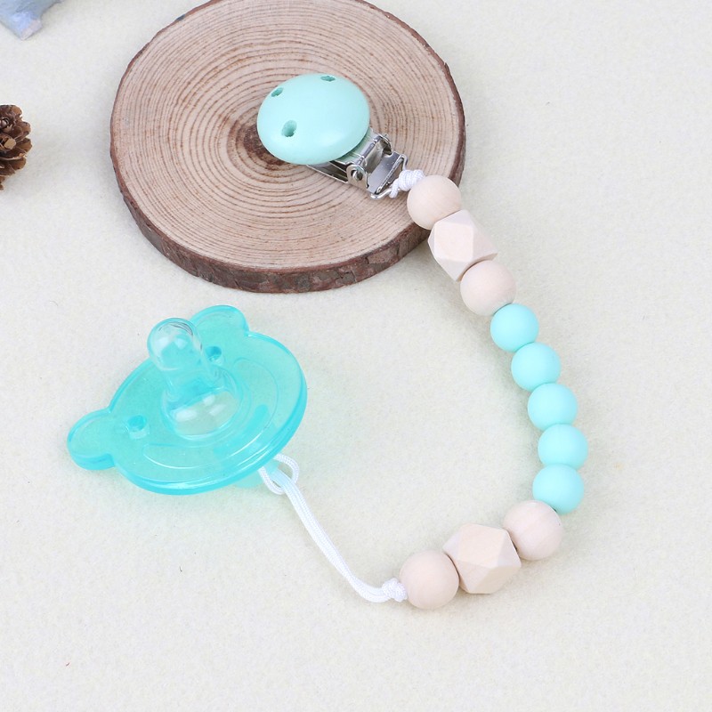 Dụng cụ giữ ti giả có kẹp gắn dây silicon