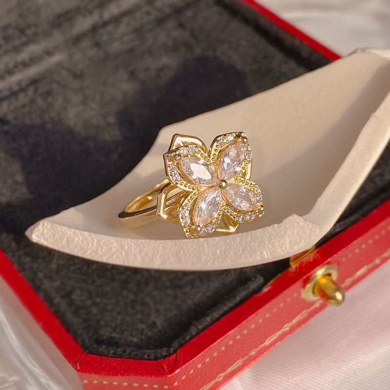 Dây chuyền/ Hoa tai/ Nhẫn mặt hoa bốn cánh đính đá zircon xoay được thời trang mùa hè dành cho bạn nữ