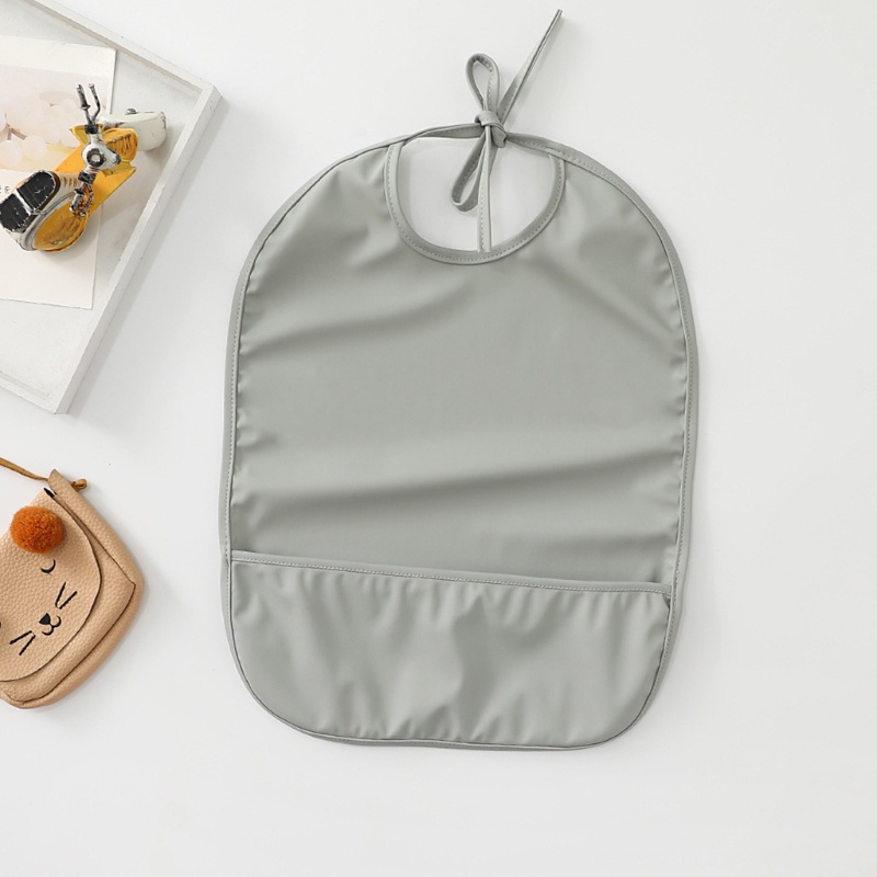 Yếm Ăn Màu Trơn Chống Thấm Nước Có Túi Tiện Dụng Cho Bé