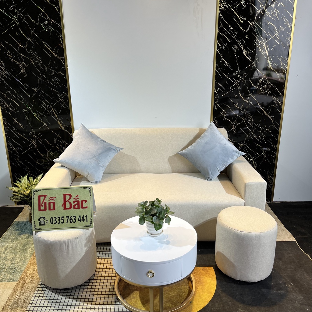 Chọn bộ ghế sofa khung gỗ tự nhiên bọc nỉ nhung màu sắc tùy chọn, có kèm bàn trà trắng tròn chân gỗ
