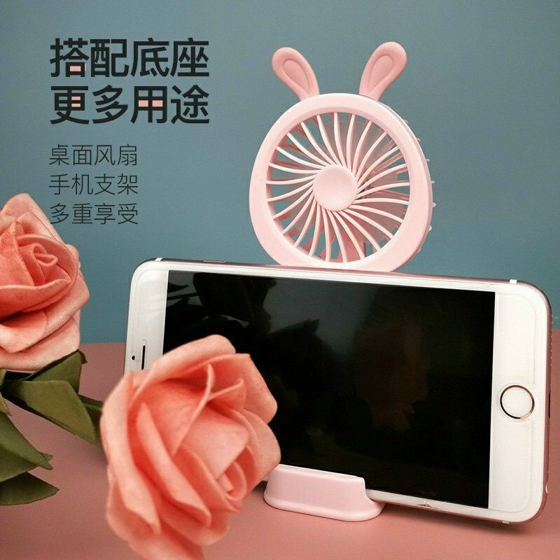 Quạt cầm tay mini có giá để điện thoại.