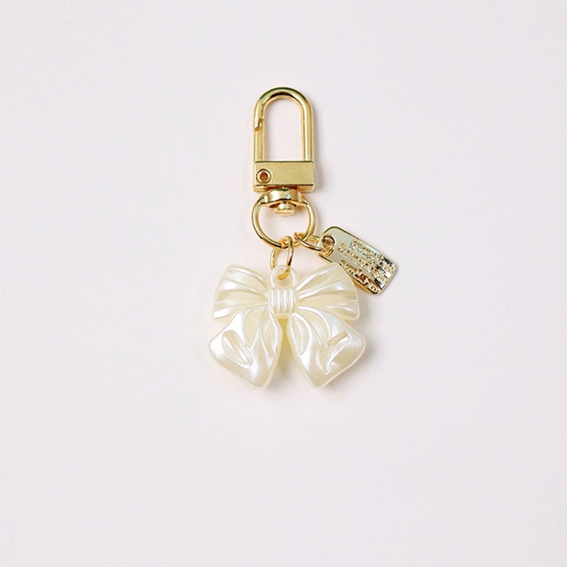 Móc Khóa Tua Rua Đính Nơ Hoa Và Ngọc Trai Sang Trọng