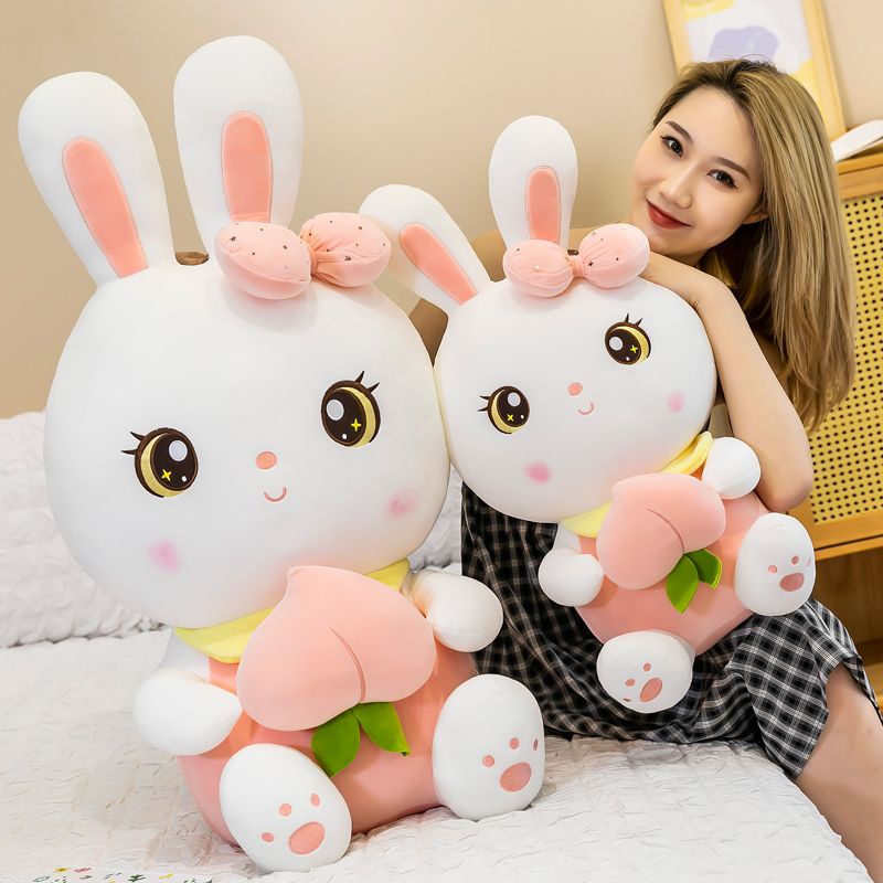 Gấu bông thỏ hồng, thỏ tai dài nhồi bông ôm trái đào vải miniso cao cấp - Unishop