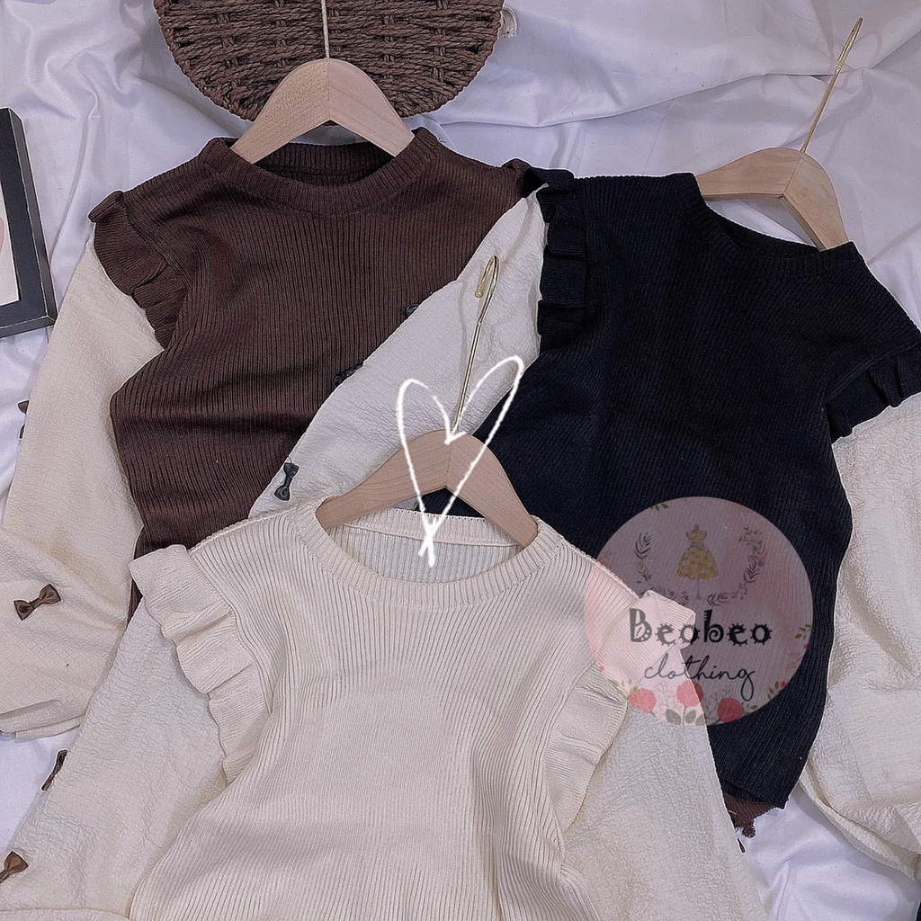 Áo len phối bèo tay phồng nude đính nơ Quảng Châu