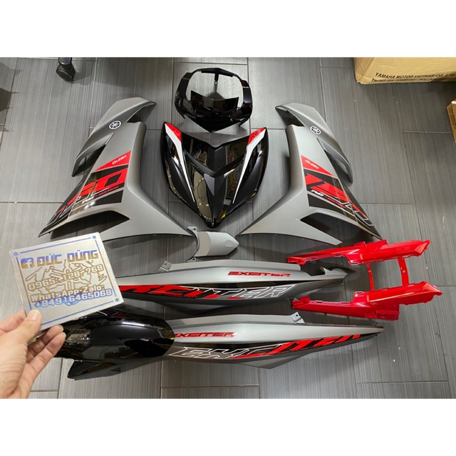 Áo ex 150 đỏ đen xám có tem