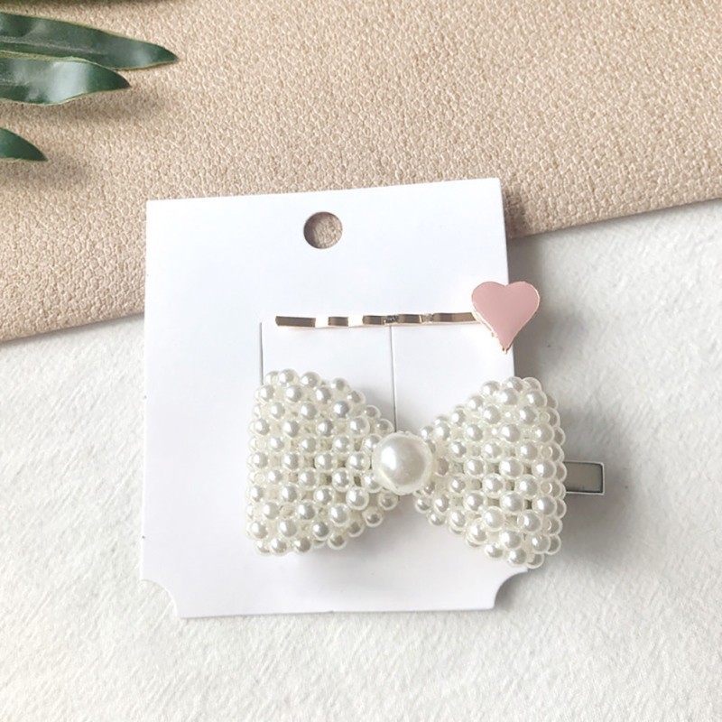 Kẹp tóc hình trái tim và ngọc trai