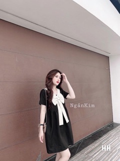 Váy suông nơ ngực trắng cổ V