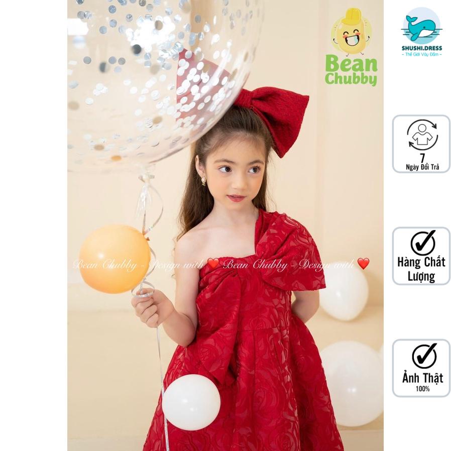 Đầm công chúa lệch vai nơ ngực vải xốp nhăn kèm nơ cặp tóc Shushibaby