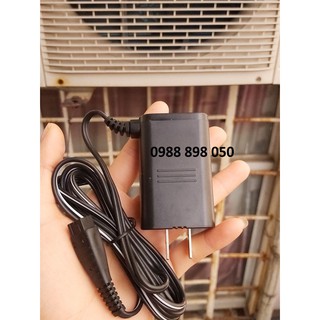 cục sạc máy cạo râu Panasonic.