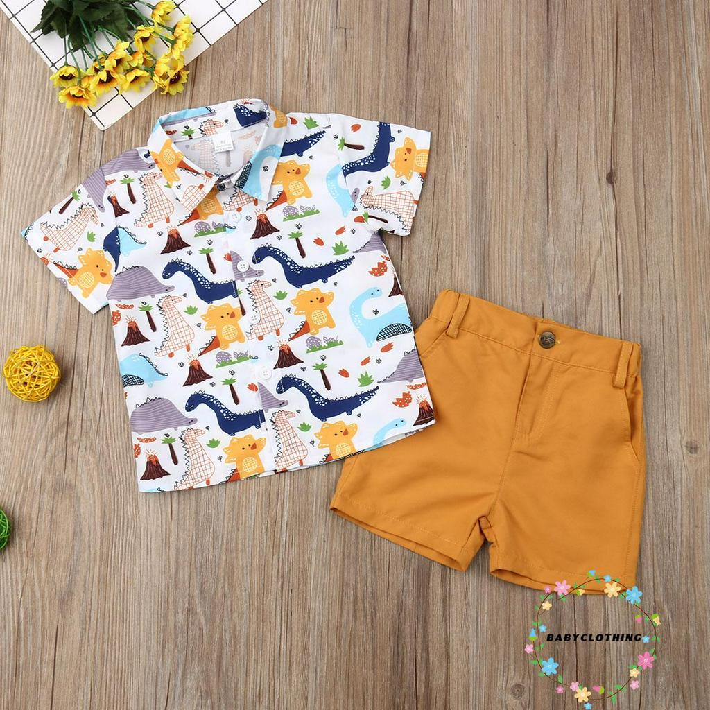 Set trang phục bé trai 2 món gồm áo sơ mi tay ngắn họa tiết khủng long và quần short thời trang