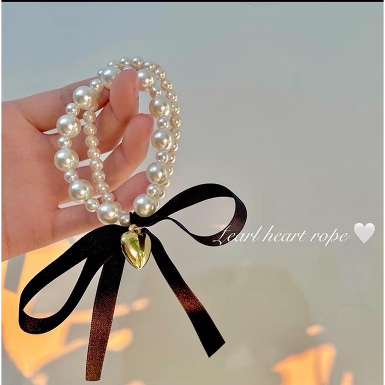 Cột tóc nơ ngọc charm tim
