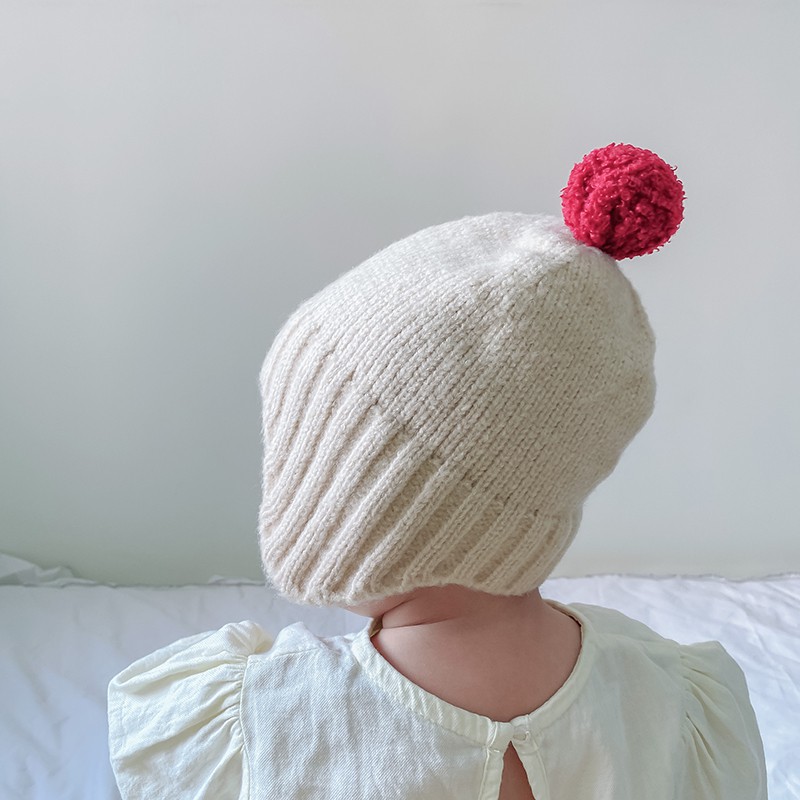 Nón len cục bông giữ ấm cho bé