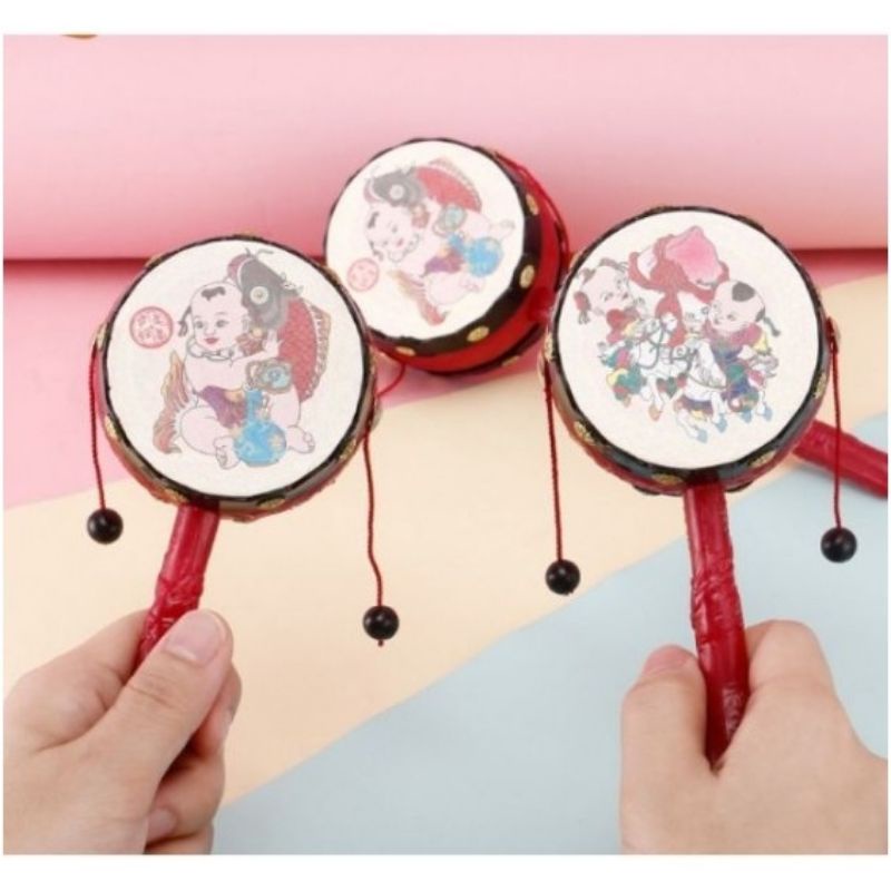 Trống lắc cầm tay cho bé