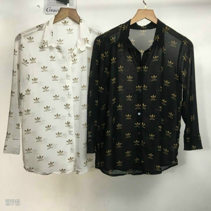 Áo sơ mi tay dài form rộng in hình logo 3 cánh cực xinh , chất voan lụa mềm mịn